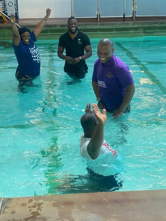 A baptism at KEMIF — celebrating new faith in Jesus